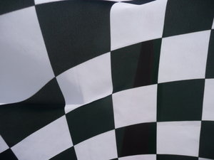 Checkered Flag: Close up of a checkered Flag at a motorbike race.
