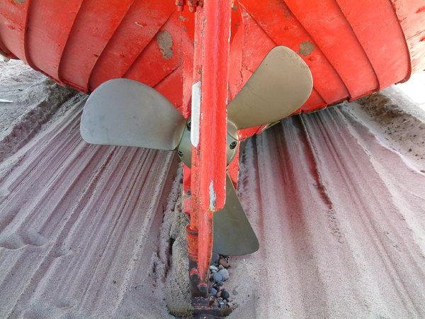 Ship's Screw: Red boat with ship's screw