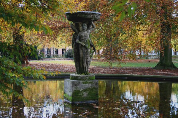 fountain in autumn: an old fountain in the park of Karlsruhe castle in autumn
