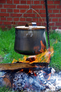 Kettle over the fire 1: Camp-fire with hanging over pot