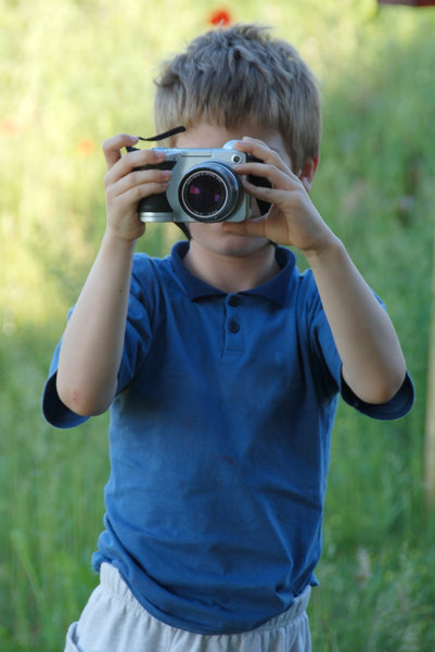 Young photographer 2: 7 year old boy by learning photography with digital camera