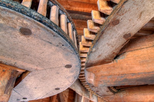 Wooden Cogwheel - HDR: Wooden cogwheel in an old windmill. The image is HDR.