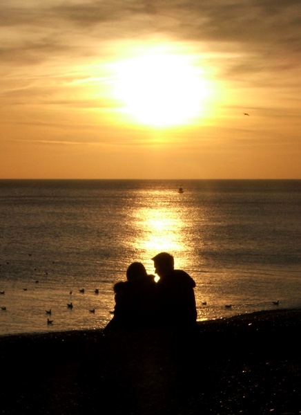 Beach Romance: Couple having a romantic moment on the beach