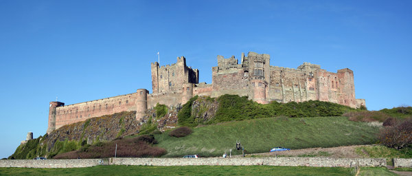 Bamburgh Castle 1: Bamburgh Castle is probably the finest castle in England. It is perched on a basalt outcrop on the very edge of the North Sea at Bamburgh, Northumberland. It commands stunning views of the Farne Islands, Holy Island and land' ward to the Cheviot hills.