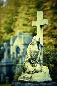 Mary: A Cross Processed image of Mary sitting at a Cross.