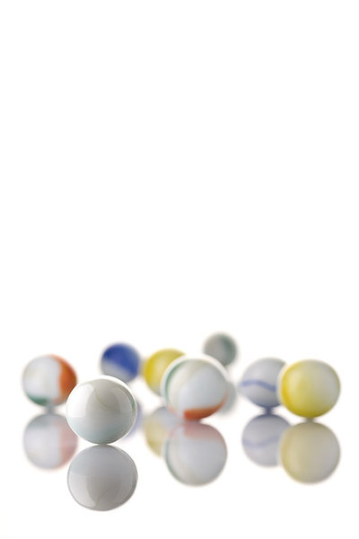 White Toy Marbles: White marbles on a white background
