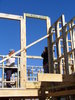 House framing with builders: Couple of builders on house frame. 