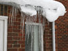Icicles and snow: Icicles and snow on a suburban outhouse.