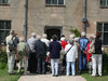 Tour group: A tour group looking at an historic house in England.