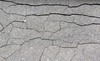 Cracked concrete texture: Wall of a derelict cowshed.