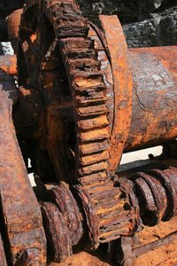 Corroded winch: A corroded fishing winch on a disused industrial wharf in Madeira
