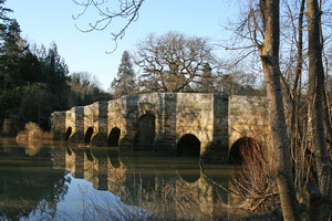 Old stone bridge: An old stone bridge in West Sussex, England, in early spring.