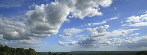 Surrey sky: View of summer cloud formations from Puttenham Common, Surrey, England. Three shot photomerge.