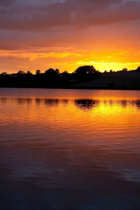 Danish sunset: Sunset over a small lake in Jutland, Denmark.