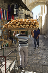 Delivering bread in Jerusalem: Delivering freshly baked bread in Old Jerusalem, Israel.
