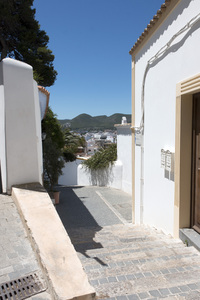 Spanish alleyway: An alleyway with a view in Ibiza, Spain.