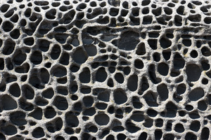 Eroded seawall: Badly eroded seawall in Dorset, England.