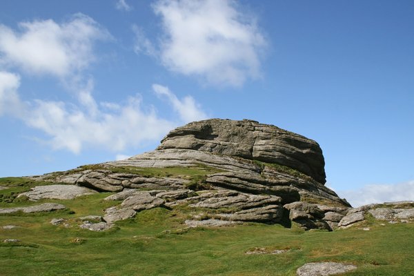 Moorland tor: A rocky tor on moorland in Devon, England, in summer.
