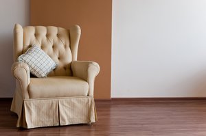 Chair and wall: Yellow chair in front of a brown wall