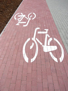 Bicycle path: A pavement brick path made for bicycles only.Please comment this shot or mail me if you found it useful. Just to let me know!I would be extremely happy to see the final work even if you think it is nothing special! For me it is (and for my portfolio)!