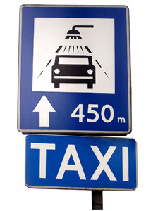 Taxi and car wash sign: Taxi and car wash. Poland.