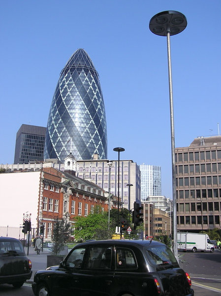 Gherkin: A wolrd famous building in London. 30 St Mary Axe also known as Swiss Re Building.