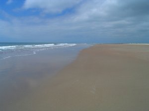 Beckoning Beach: This beach is located at Oak Island, North Carolina with the Atlanitc Ocean, Blue Sky and reflections, beckons a visit. Summer