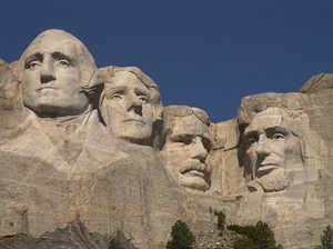 Mount Rushmore - South Dakota: Close up of Mount Rushmore and the faces carved into granite of Presidents Washington, Jefferson, Roosevelt and Lincoln located in South Dakota.