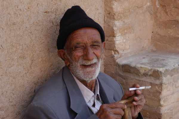 Old Man: Old man smoking cigarette.
