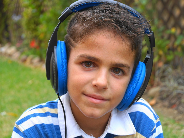 Boy listening to music: no description