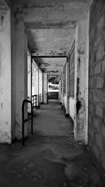 Looking down a corridor: old run down building