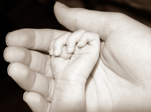 secure: baby hand in mothers hand