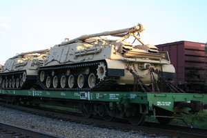 Military Tanks on Train: Military Tanks being transported on a Train