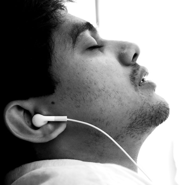 Man: A young man listening to music