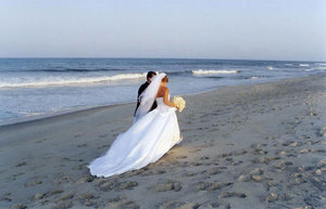 Beach Wedding: A couple on Tybee Beach, Georgia, right after they had exchanged vows