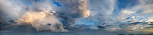 Evening Sky Panorama: At sunset, or just after magic hour, an assortment of different cloud types above the ocean