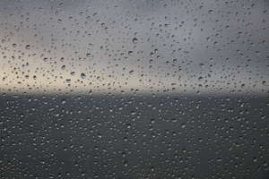 Window: Window to the ocean in a hard rain day