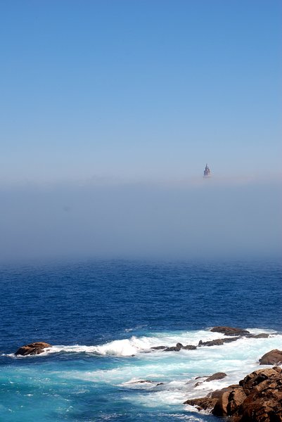 The fog & the Tower of Hércul: Ancient Roman lighthouse. The structure is 55 metres (180 ft) tall and overlooks the North Atlantic coast of Spain. The structure, almost 1900 years old and rehabilitated in 1791, is the oldest Roman lighthouse still used as a lighthouse. UNESCO World