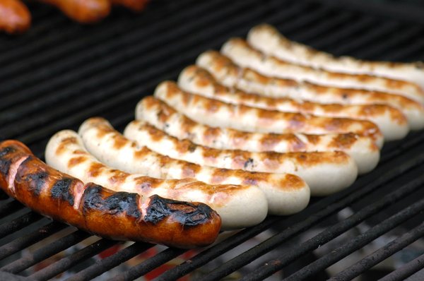 Sausages: sausages on a grill