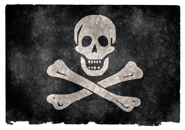 Jolly Roger Grunge Flag: Grunge textured Jolly Roger pirate flag on vintage paper. You can find hundreds of grunge flags on my website www.freestock.ca in the Flags & Maps category, I'm just posting a sample here because I do not want to spam rgbstock ;-p