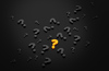 Burning question 2: Questions and answers concept. Many question marks on dark background.