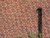 brickwall and pipe: brickwall and pipe captured in Lund, Sweden.