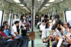 train trip: passengers travelling on mass rapid transit train in Singapore