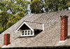 rooftops and chimneys: rural house roof with wooden tiles