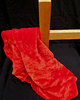cross & crown of thorns: red cloth draped wooden cross and black background