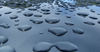 rained on2: raindrops accumulating on hard surface