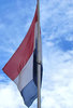 flag flying high2: Dutch flag flying high on flagpole