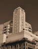 art deco clock tower4: large city art deco commerical business complex tower clock  - in sepia