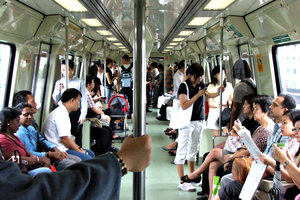 train trip: passengers travelling on mass rapid transit train in Singapore