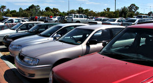 in the carpark: cars - motor vehicles in shopping centre carpark